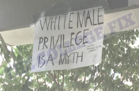 Screenshot-2018-4-23_Someone_hung_a_White_Male_Privilege_Is_A_Myth_poster_next_to_the_Dismantle_Whiteness_mural_Guess_w....png